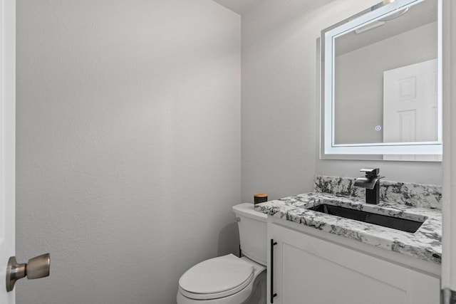 9117 Roundbluff Rd, Plano, TX 75025 - bathroom featuring vanity and toilet