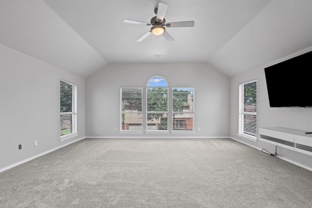 9117 Roundbluff Rd, Plano, TX 75025 - unfurnished living room featuring carpet floors, ceiling fan, vaulted ceiling, and baseboards