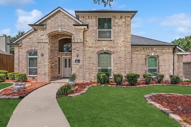 9117 Roundbluff Rd, Plano, TX 75025 - french provincial home with brick siding and a front yard