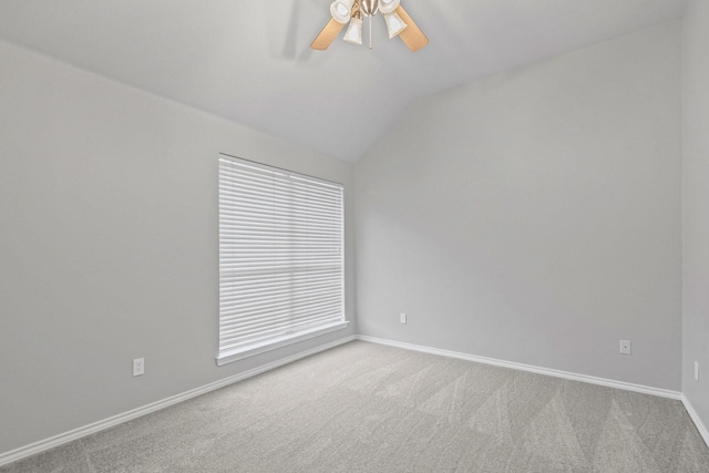 9117 Roundbluff Rd, Plano, TX 75025 - spare room featuring ceiling fan, vaulted ceiling, carpet floors, and baseboards