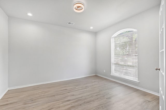 9117 Roundbluff Rd, Plano, TX 75025 - unfurnished room featuring light wood-style floors, baseboards, and recessed lighting