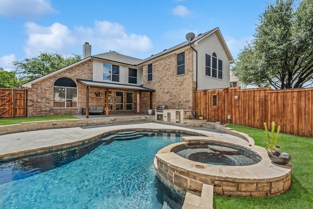 9117 Roundbluff Rd, Plano, TX 75025 - back of house featuring brick siding, a fenced backyard, a patio, exterior kitchen, and a chimney