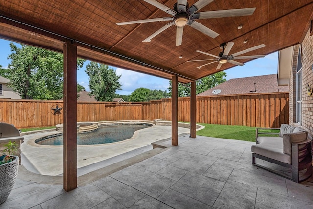 9117 Roundbluff Rd, Plano, TX 75025 - fenced backyard featuring a pool with connected hot tub, ceiling fan, and a patio area