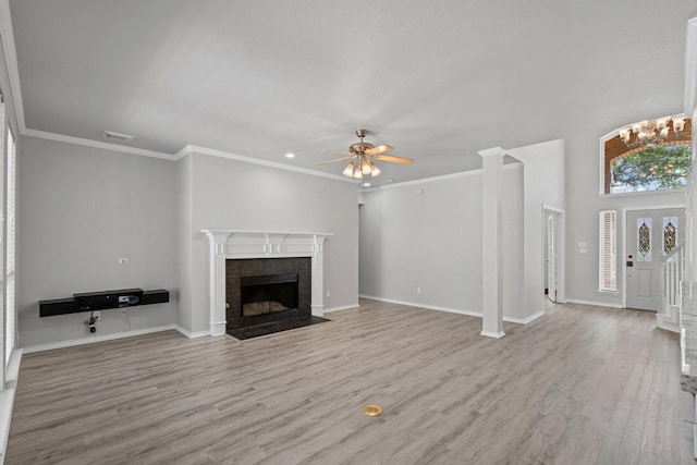 9117 Roundbluff Rd, Plano, TX 75025 - unfurnished living room featuring a ceiling fan, wood finished floors, a fireplace with flush hearth, baseboards, and crown molding