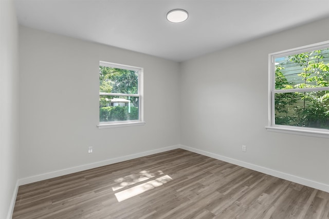 4423 Harvey Dr, Mesquite, TX 75150 - spare room featuring light wood-style floors and baseboards