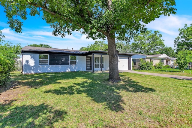 4423 Harvey Dr, Mesquite, TX 75150 - view of front of house with an attached garage, driveway, a front yard, and brick siding
