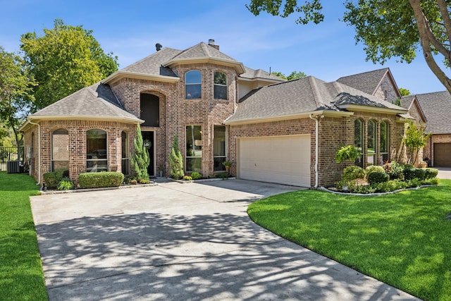 5516 Greenview Ct, North Richland Hills, TX 76148 - french country inspired facade featuring roof with shingles, brick siding, a garage, and driveway
