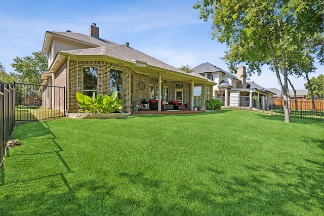 5516 Greenview Ct, North Richland Hills, TX 76148 - back of house featuring brick siding, a patio area, roof with shingles, and a chimney