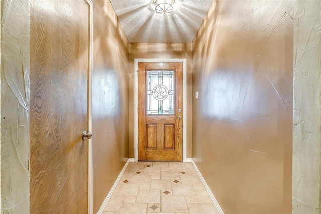 4428 Aspen Way, Haltom City, TX 76137 - doorway to outside featuring baseboards and light stone finish floors