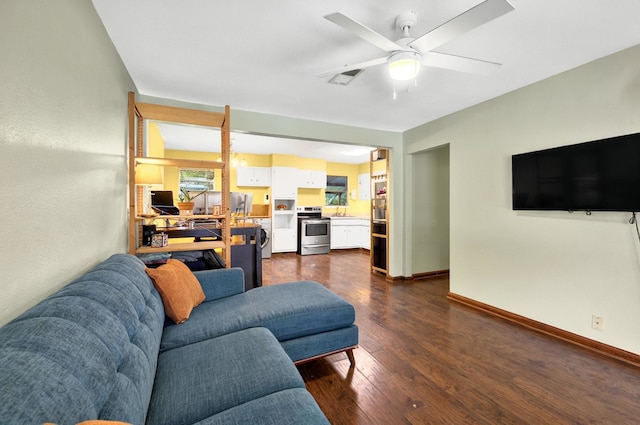7932 Tumbleweed Trl, White Settlement, TX 76108 - living room featuring dark wood-style flooring, a ceiling fan, and baseboards