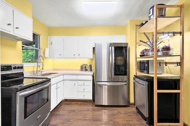 7932 Tumbleweed Trl, White Settlement, TX 76108 - kitchen featuring appliances with stainless steel finishes, a sink, dark wood finished floors, and white cabinets