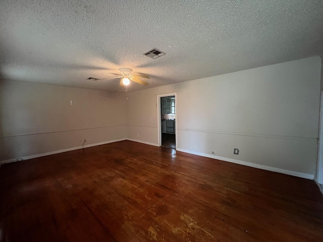 3304 Fadal Ave, Waco, TX 76708 - spare room featuring wood finished floors, a textured ceiling, a ceiling fan, and baseboards