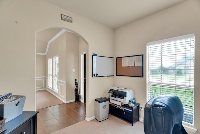 136 Devonshire Dr, Waxahachie, TX 75167 - home office with light colored carpet, arched walkways, and light tile patterned floors