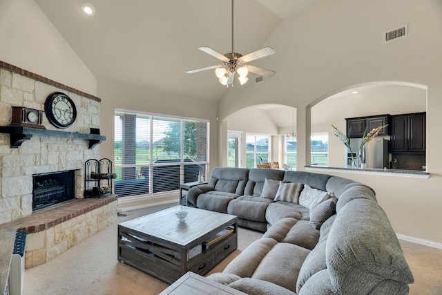 136 Devonshire Dr, Waxahachie, TX 75167 - living area with arched walkways, a ceiling fan, high vaulted ceiling, light carpet, and healthy amount of natural light
