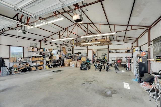 136 Devonshire Dr, Waxahachie, TX 75167 - garage featuring a garage door opener and a workshop area