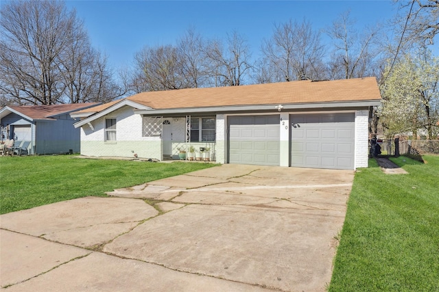 420 Shady Oaks Ln, Paris, TX 75460 - view of front facade with brick siding, a garage, and concrete driveway