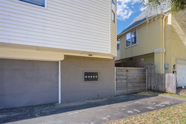 5105 Vandelia St, Dallas, TX 75235 - view of home's exterior featuring brick siding and an attached garage