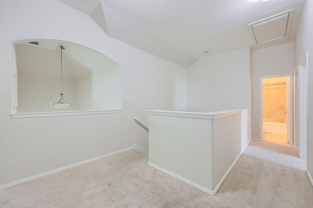 1017 Oarlock Dr, Crowley, TX 76036 - hall with an upstairs landing, carpet floors, attic access, baseboards, and lofted ceiling