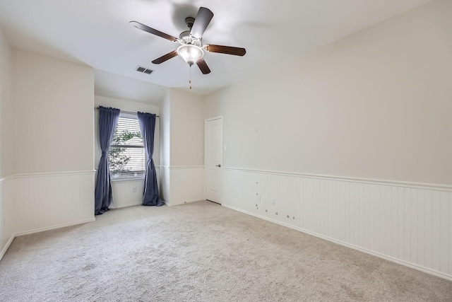 1017 Oarlock Dr, Crowley, TX 76036 - carpeted empty room featuring wainscoting and a ceiling fan