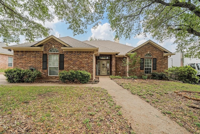 209 Keswick Dr, Hewitt, TX 76643 - view of front of home with brick siding and a shingled roof