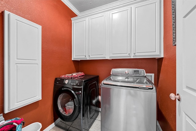 209 Keswick Dr, Hewitt, TX 76643 - laundry room featuring washing machine and dryer, cabinet space, crown molding, tile patterned floors, and baseboards