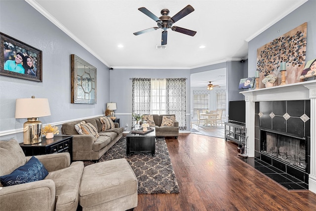 209 Keswick Dr, Hewitt, TX 76643 - living area with a ceiling fan, wood finished floors, crown molding, recessed lighting, and a fireplace