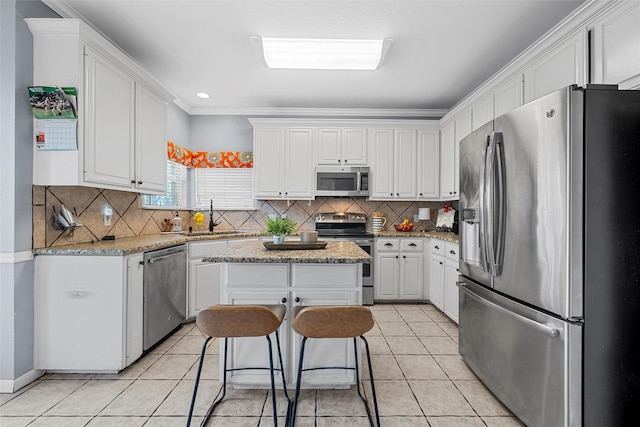 209 Keswick Dr, Hewitt, TX 76643 - kitchen with appliances with stainless steel finishes, a sink, white cabinetry, tasteful backsplash, and recessed lighting