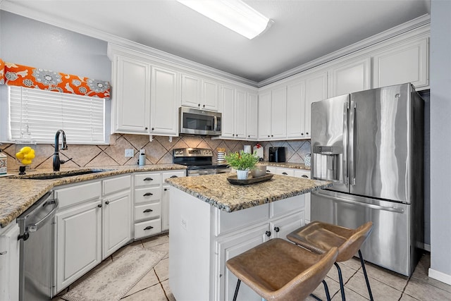 209 Keswick Dr, Hewitt, TX 76643 - kitchen featuring appliances with stainless steel finishes, a sink, and white cabinets
