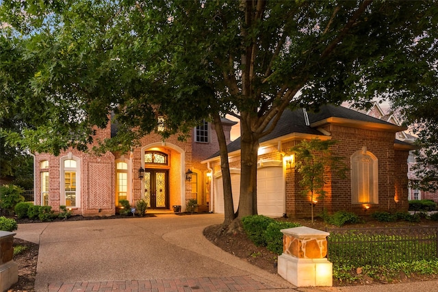 603 Regency Xing, Southlake, TX 76092 - view of front of house with brick siding, a garage, concrete driveway, and french doors