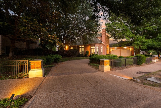 603 Regency Xing, Southlake, TX 76092 - view of property hidden behind natural elements featuring a fenced front yard, a chimney, and a garage