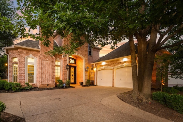 603 Regency Xing, Southlake, TX 76092 - view of front of house featuring brick siding, driveway, an attached garage, and a shingled roof