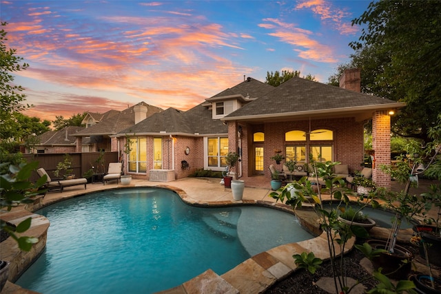 603 Regency Xing, Southlake, TX 76092 - pool at dusk featuring a patio area and an outdoor hangout area