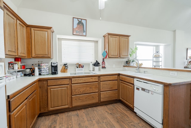 1415 Clubhill Dr, Rockwall, TX 75087 - kitchen with white dishwasher, a sink, dark wood-type flooring, a peninsula, and light countertops