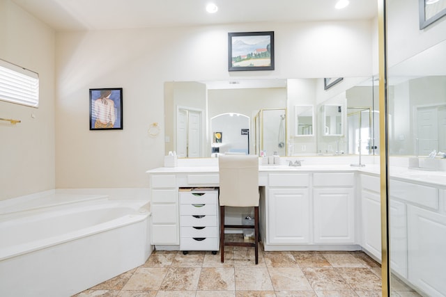 1415 Clubhill Dr, Rockwall, TX 75087 - full bath with a stall shower, a bath, two vanities, and recessed lighting