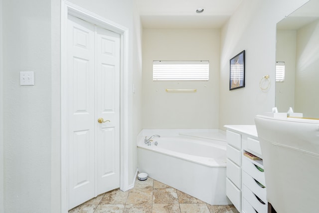 1415 Clubhill Dr, Rockwall, TX 75087 - full bath featuring vanity, a garden tub, and a closet