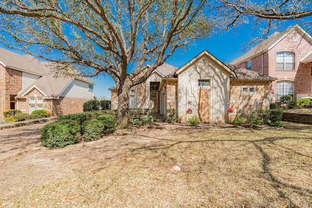 1415 Clubhill Dr, Rockwall, TX 75087 - view of front facade with brick siding and a front lawn