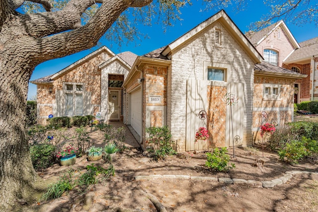 1415 Clubhill Dr, Rockwall, TX 75087 - view of front of property featuring brick siding, a garage, and stone siding