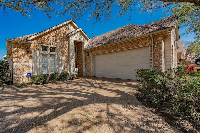 1415 Clubhill Dr, Rockwall, TX 75087 - view of front of home featuring concrete driveway, a garage, and brick siding