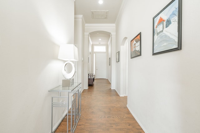 1415 Clubhill Dr, Rockwall, TX 75087 - hallway with arched walkways, crown molding, wood finished floors, baseboards, and recessed lighting