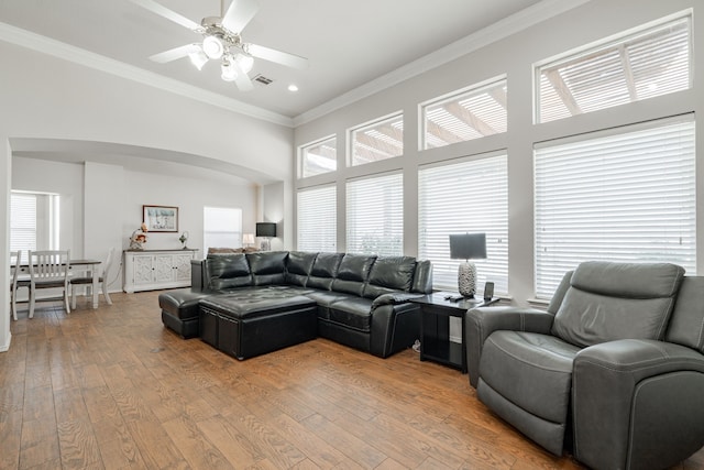 1415 Clubhill Dr, Rockwall, TX 75087 - living room with ornamental molding, ceiling fan, light wood-style floors, a high ceiling, and recessed lighting