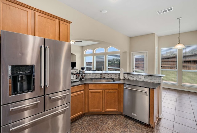 12816 Lizzie Pl, Fort Worth, TX 76244 - kitchen with stainless steel appliances, a sink, healthy amount of natural light, and a ceiling fan