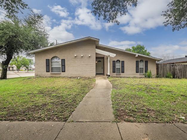 1901 Castille Dr, Carrollton, TX 75007 - view of front of home featuring brick siding
