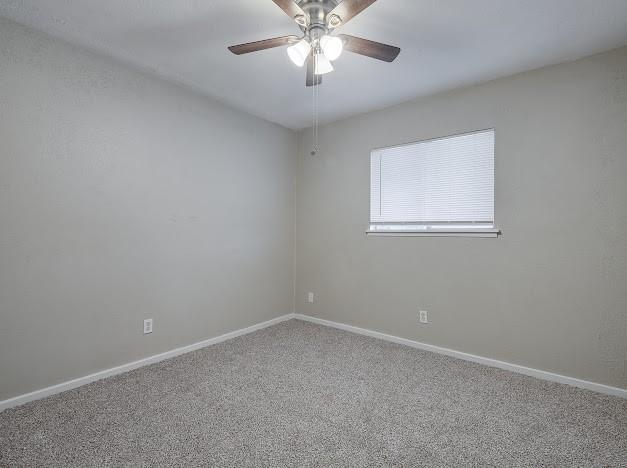 1901 Castille Dr, Carrollton, TX 75007 - carpeted spare room with ceiling fan and baseboards