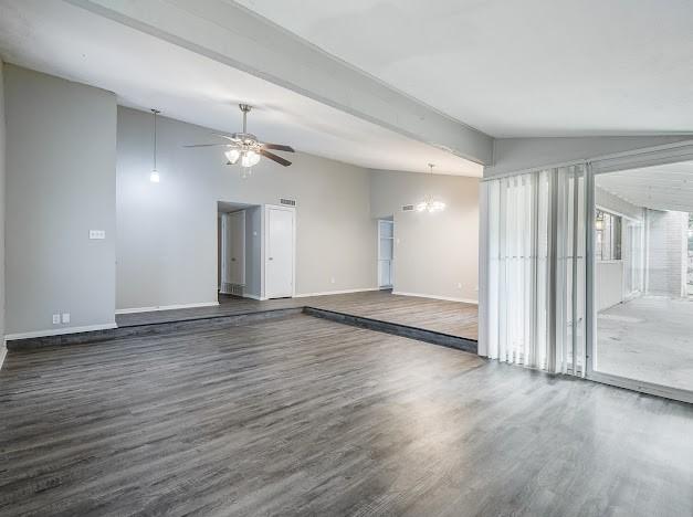 1901 Castille Dr, Carrollton, TX 75007 - spare room featuring wood finished floors, lofted ceiling, baseboards, and ceiling fan