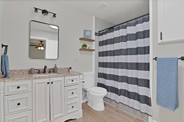 214 Bluebonnet Trl, Keene, TX 76059 - bedroom featuring carpet floors, baseboards, connected bathroom, and ceiling fan