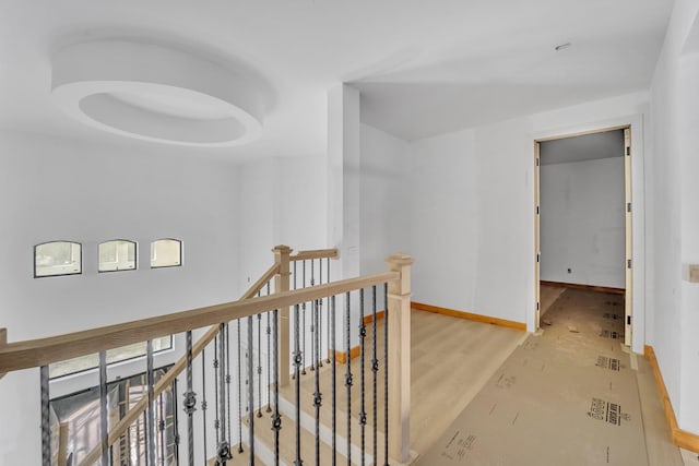 1010 W Mcdonwell School Rd, Colleyville, TX 76034 - corridor featuring an upstairs landing, baseboards, and wood finished floors