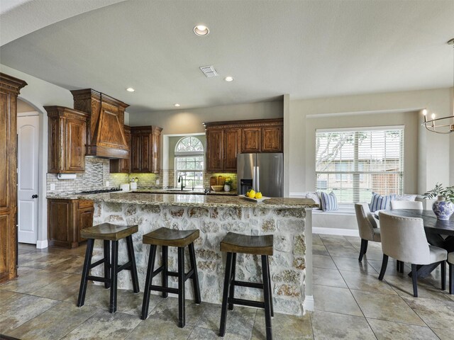 2420 Lilyfield Dr, Trophy Club, TX 76262 - kitchen featuring appliances with stainless steel finishes, premium range hood, decorative backsplash, baseboards, and recessed lighting