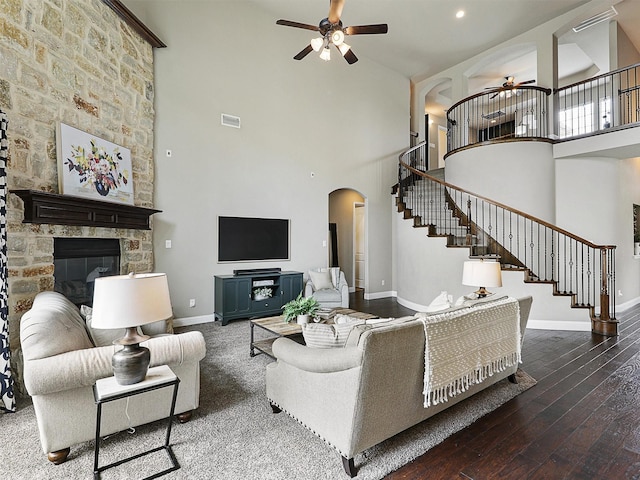 2420 Lilyfield Dr, Trophy Club, TX 76262 - living area featuring ceiling fan, arched walkways, stairway, a high ceiling, and baseboards