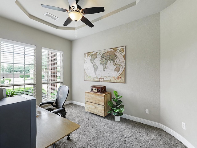 2420 Lilyfield Dr, Trophy Club, TX 76262 - carpeted office featuring a ceiling fan, baseboards, and a tray ceiling