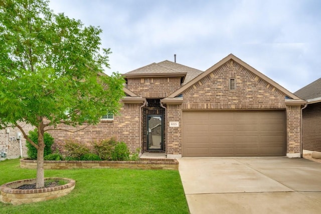 8325 High Garden St, Fort Worth, TX 76123 - view of front facade featuring brick siding, a garage, concrete driveway, a front lawn, and roof with shingles